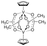 Tetrakis(acetato)bis(cyclopentadienyl)divanadium(III)